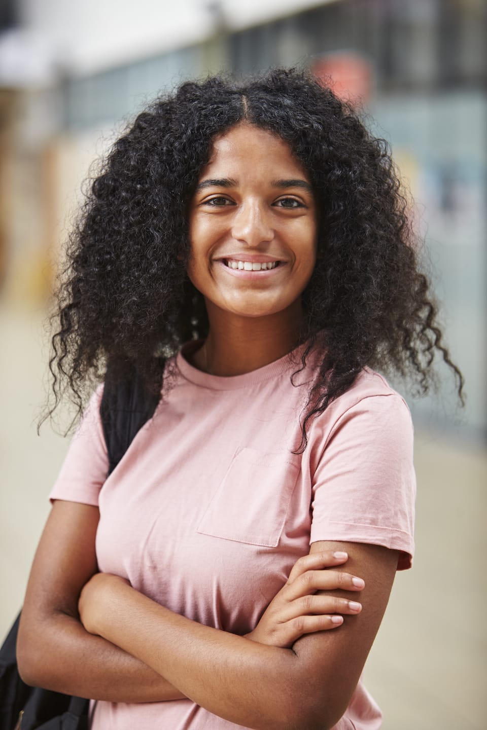 portrait-of-female-student-standing-in-college-PTK57Z8
